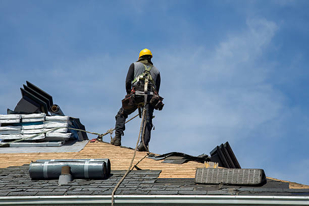 Professional Roof Replacement technician working in Halltown, WV